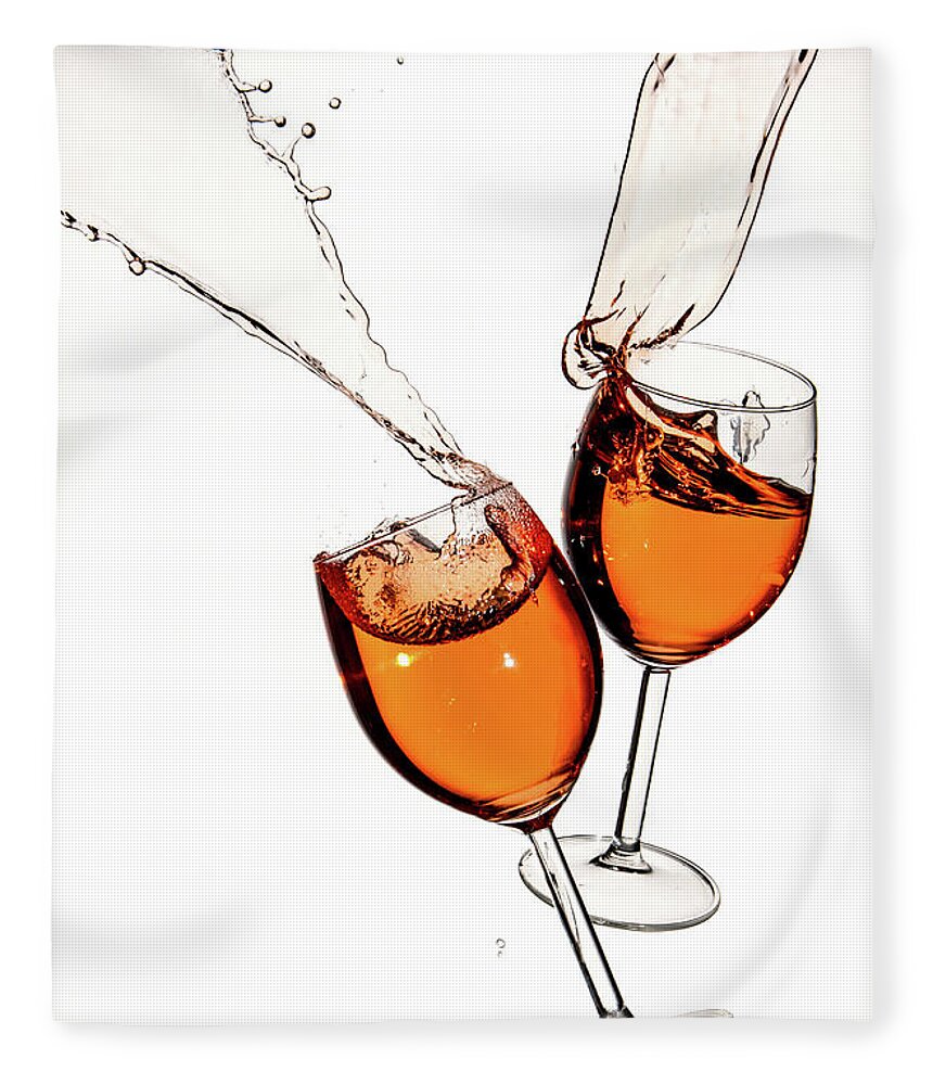 Alcohol Fleece Blanket featuring the photograph Red wine in glasses with splashes on a white background isolated by Michalakis Ppalis