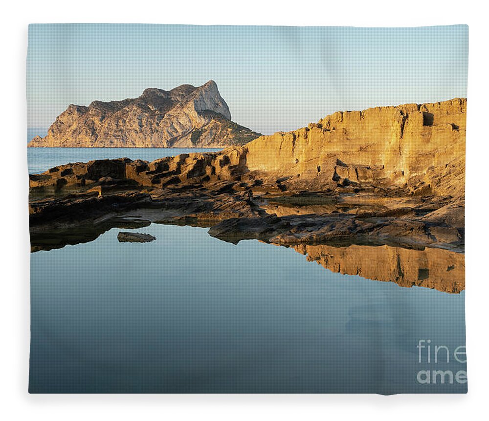 Mediterranean Fleece Blanket featuring the photograph Reflection of rocks in the calm Mediterranean Sea at sunrise 2 by Adriana Mueller