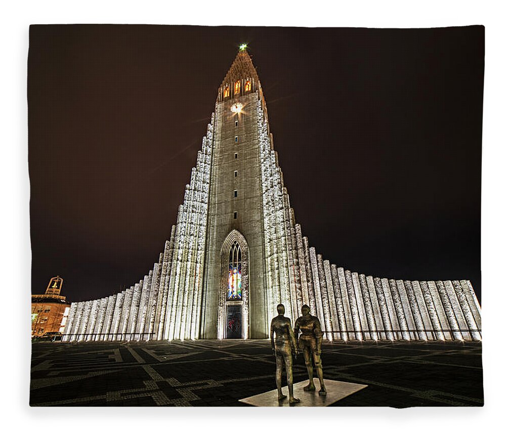 Reykjavik Fleece Blanket featuring the photograph Reykjavik Iceland Hallgrimskirkja Statues by Toby McGuire