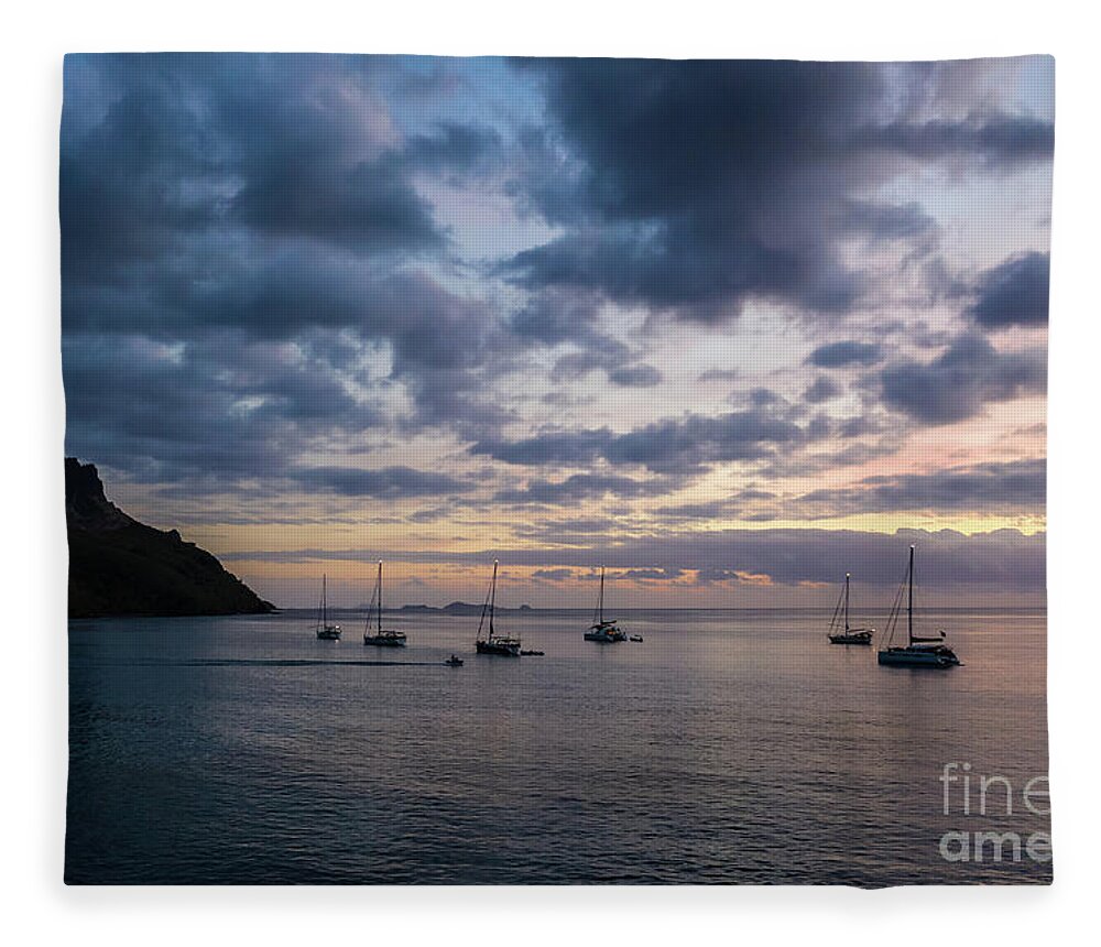 Asia Pacific Fleece Blanket featuring the photograph Sailboats anchored for the night by an island in the Yasawa grou by Didier Marti