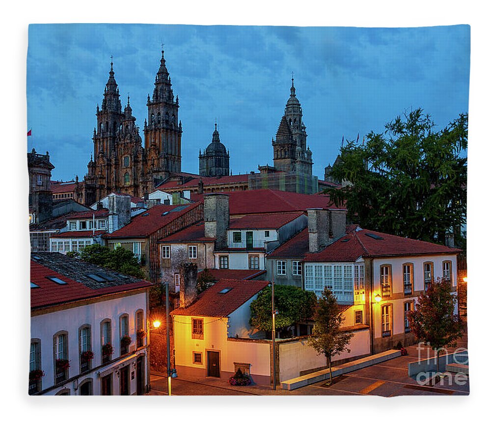 Way Fleece Blanket featuring the photograph Santiago de Compostela Cathedral Spectacular View by Night Dusk with Street Lights and Tiled Roofs La Corua Galicia by Pablo Avanzini