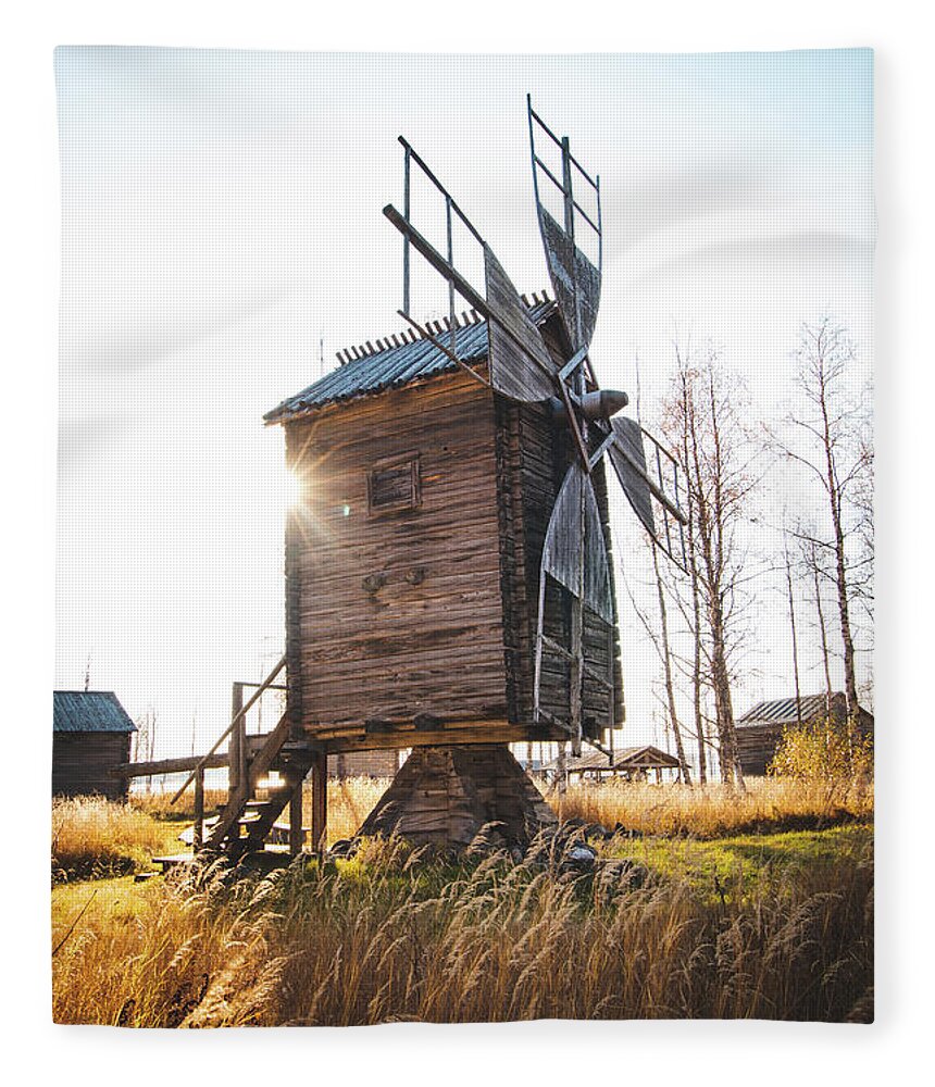 Medieval Fleece Blanket featuring the photograph Small wooden mill with beautiful sun star by Vaclav Sonnek