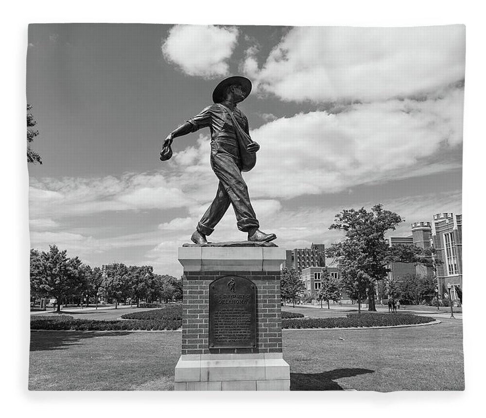 Big 12 Fleece Blanket featuring the photograph Sower Statue on the campus of the University of Oklahoma in black and white by Eldon McGraw