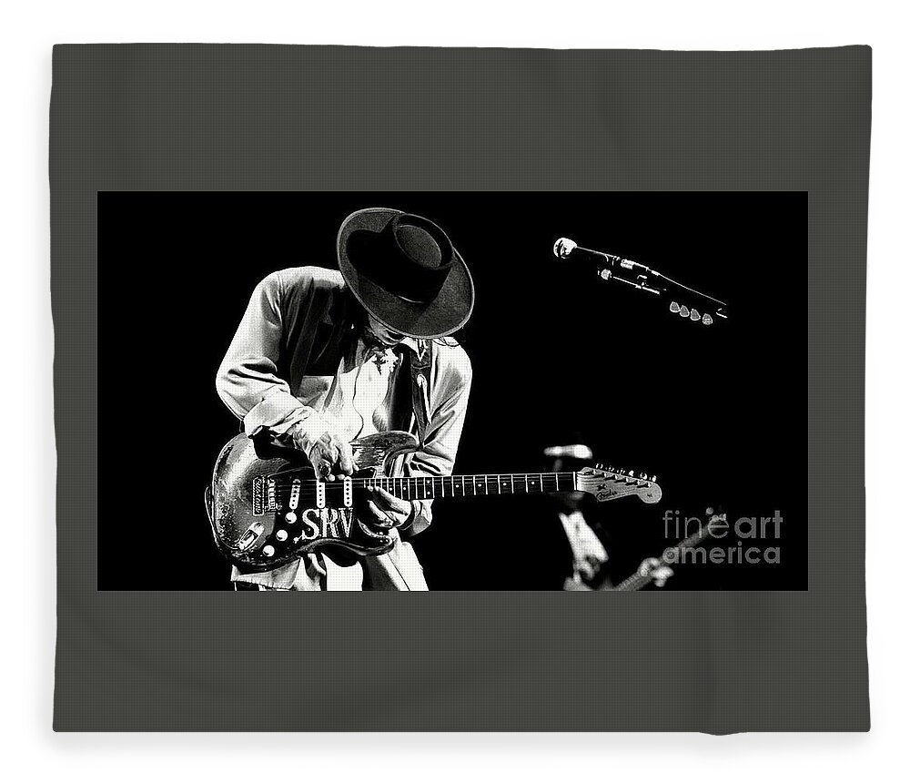 Stevie Ray Vaughan Fleece Blanket featuring the photograph Stevie Ray Vaughan in concert by Action