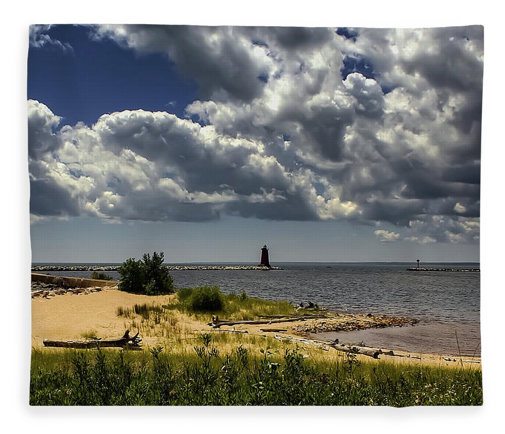 Lake Michigan Fleece Blanket featuring the photograph Storm Clouds Over the Manistique Light by Deb Beausoleil