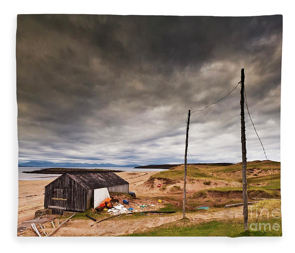 Scotland Beach Fleece Blanket featuring the photograph Stormy sky and abandoned fishing hut, Red point beach, Wester Ross, Scotland by Neale And Judith Clark
