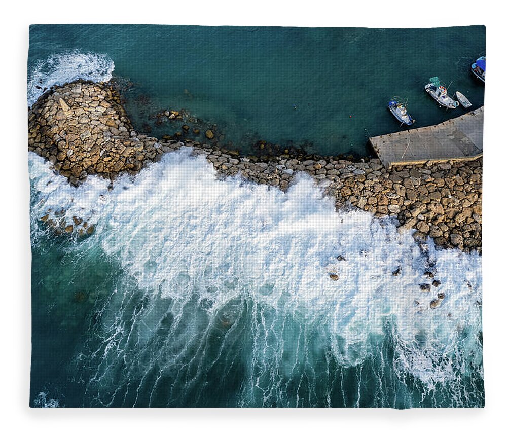 Brakewater Fleece Blanket featuring the photograph Stormy windy waves on the shore. Drone photography. by Michalakis Ppalis