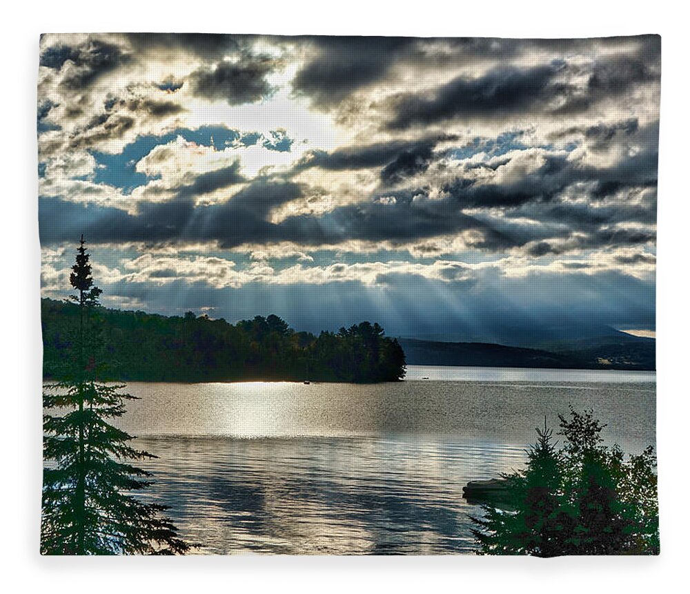 Sun Fleece Blanket featuring the photograph Sun Rays and Storm Clouds Over Rangeley Maine by Russel Considine