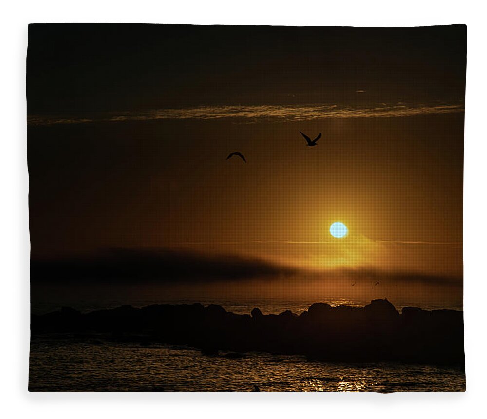 Sunset Fleece Blanket featuring the photograph Sunset over the ocean by Micah Offman
