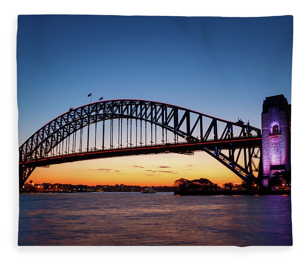 Arch Fleece Blanket featuring the photograph Sydney Harbour Bridge illuminated at sunset by Rick Deacon