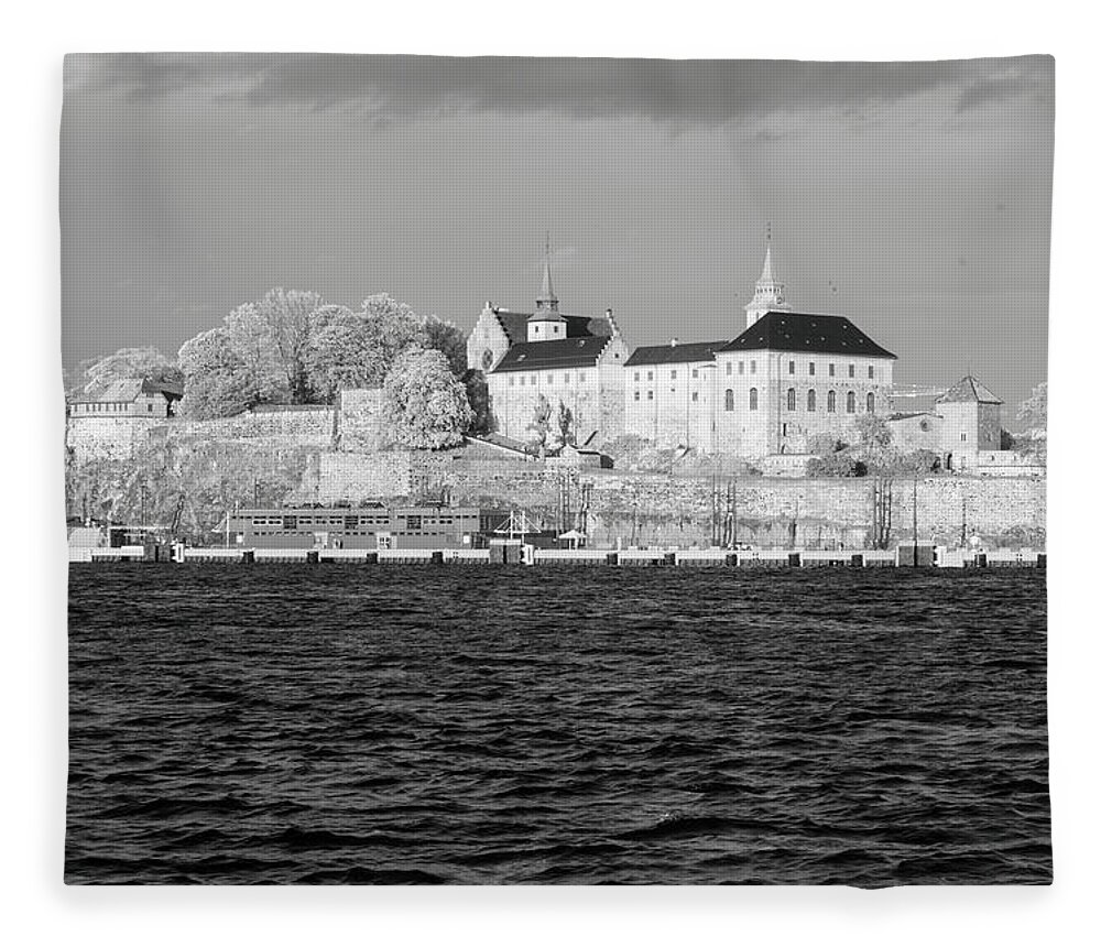 Old Fleece Blanket featuring the photograph The Akershus castle in Oslo from the sea in infrared black and white by Maria Dimitrova