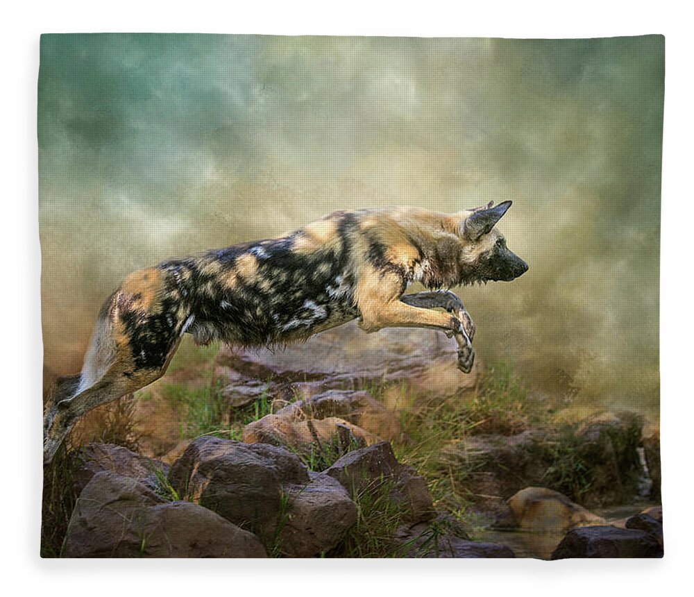 African Wild Dog Fleece Blanket featuring the digital art The Leap by Nicole Wilde