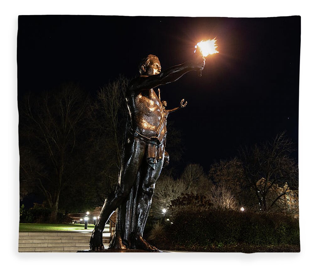 University Of Tennessee At Night Fleece Blanket featuring the photograph Torchbearer statue at the University of Tennessee at night by Eldon McGraw