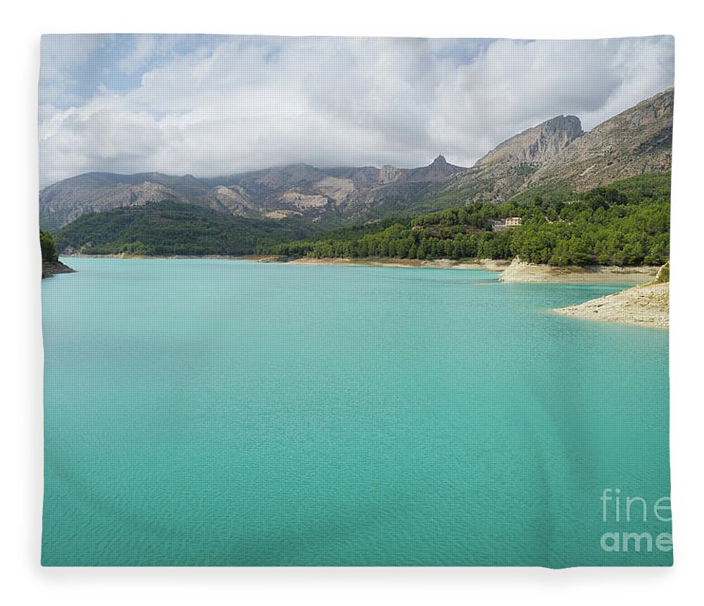 Guadalest Fleece Blanket featuring the photograph Turquoise blue water and mountain landscape by Adriana Mueller