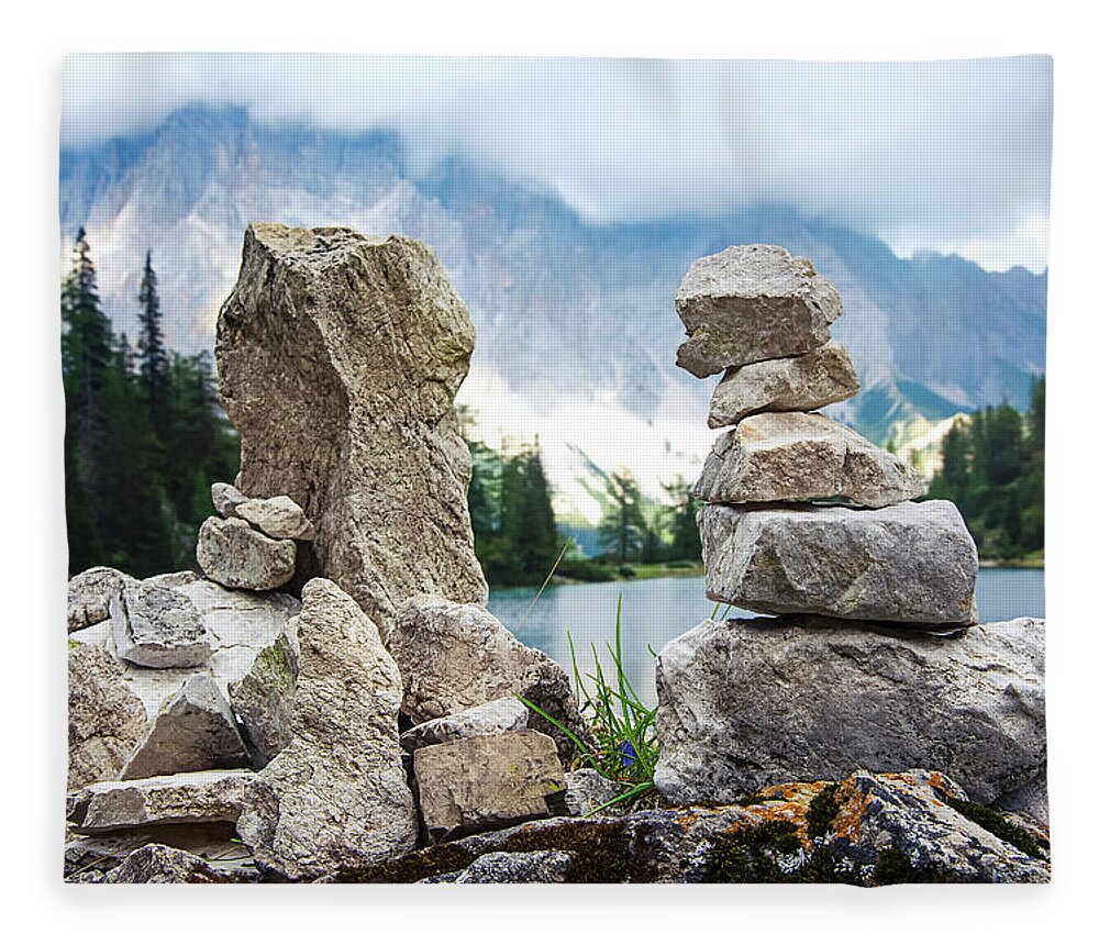 Two Fleece Blanket featuring the photograph Two stone towers as route markers. by Bernhard Schaffer