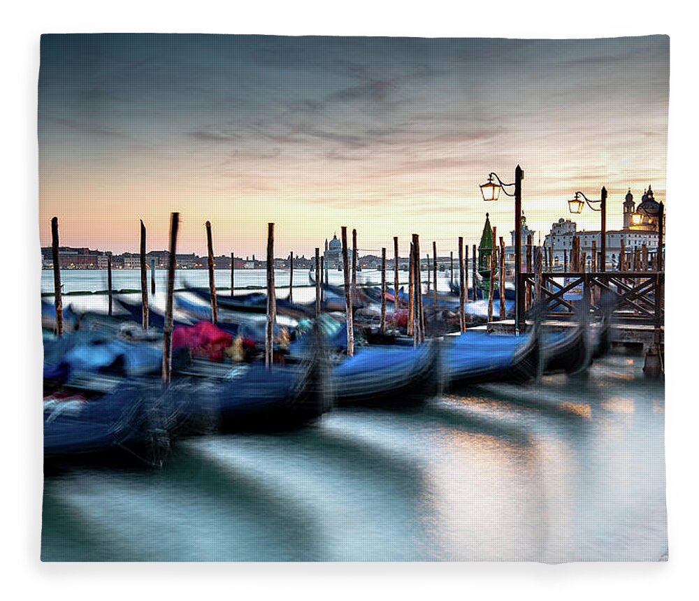 Gondola Fleece Blanket featuring the photograph Venice Gondolas moored at the San Marco square. by Michalakis Ppalis