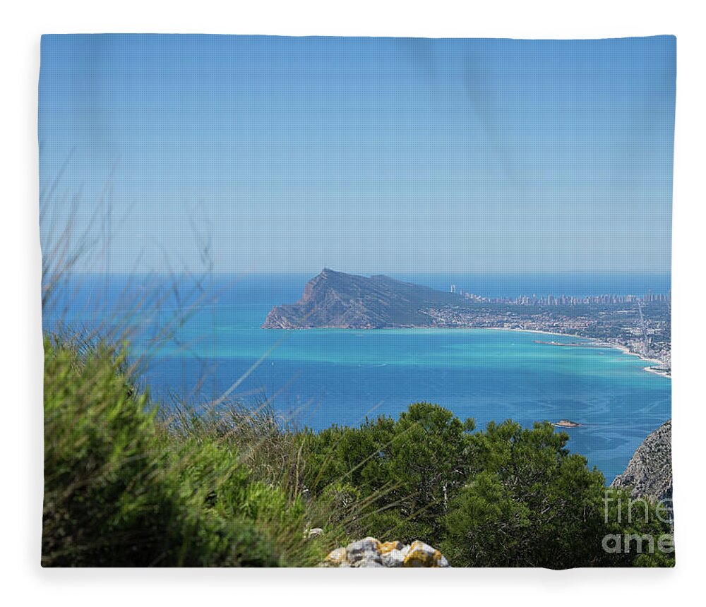Spain Fleece Blanket featuring the photograph View of the coast and the Mediterranean sea in Benidorm by Adriana Mueller