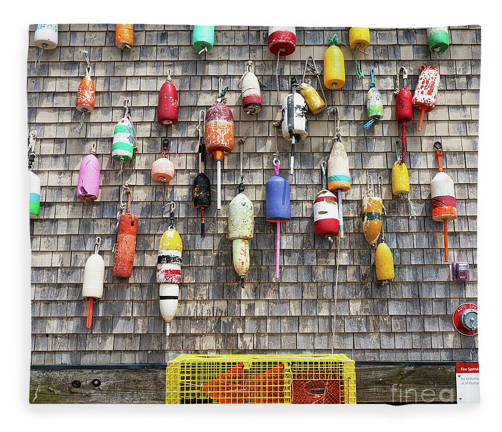 Vintage lobster buoys hanging on a weathered wall with yellow tr Fleece  Blanket by David Wood - Pixels