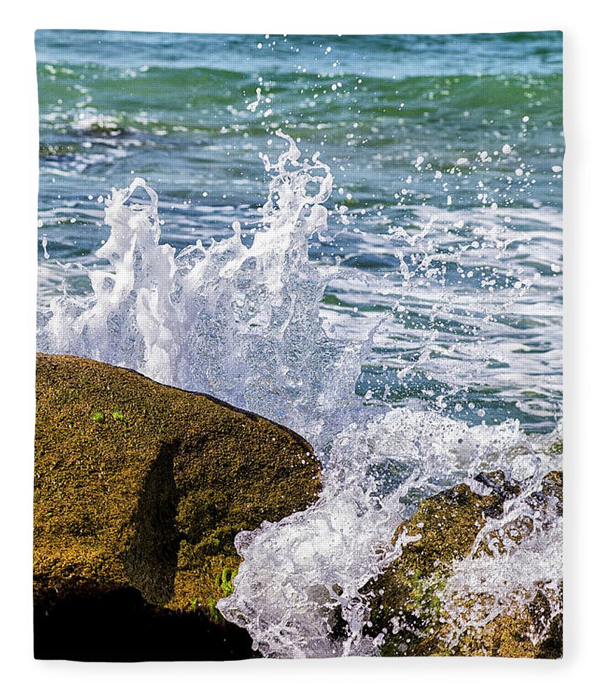 Wave Fleece Blanket featuring the photograph Wave Break Against Rocks on Atlantic Beach by Bob Decker