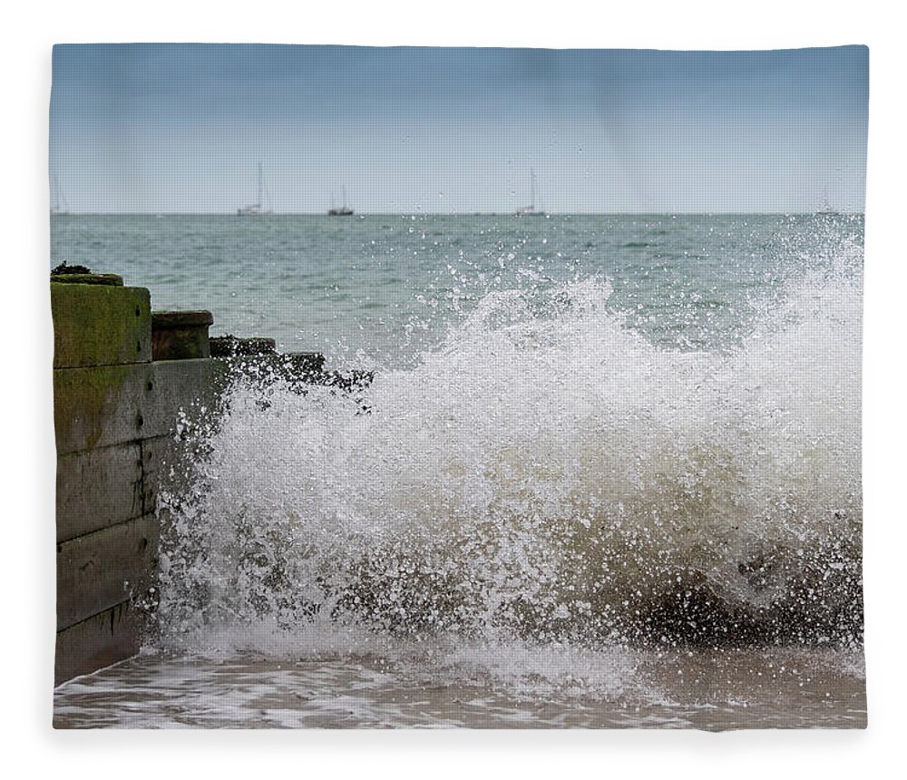 Eastbourne Fleece Blanket featuring the photograph Wave splash by Andrew Lalchan