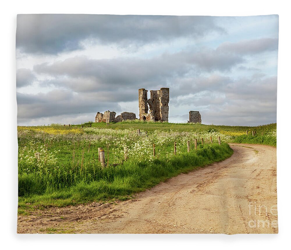 British Fleece Blanket featuring the photograph Winding road leading to a chirch ruin in Norfolk by Simon Bratt