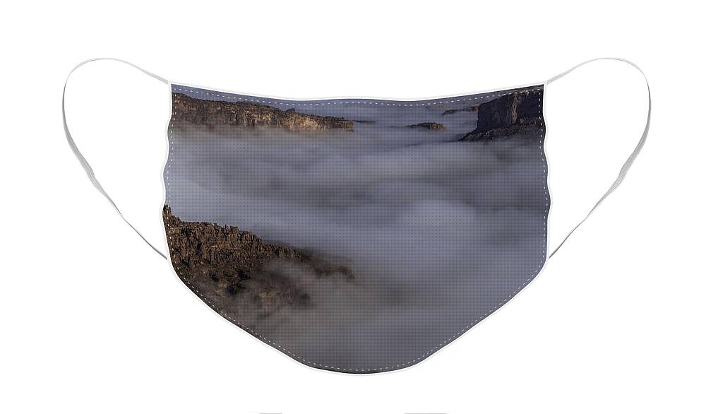 Imported Keyword Tags Face Mask featuring the photograph Canyon Rims Float In Fog by Deborah Hughes