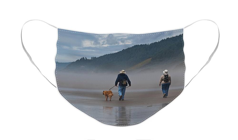 Active Seniors Face Mask featuring the photograph Elderly Couple Walking a Dog by Jeff Goulden