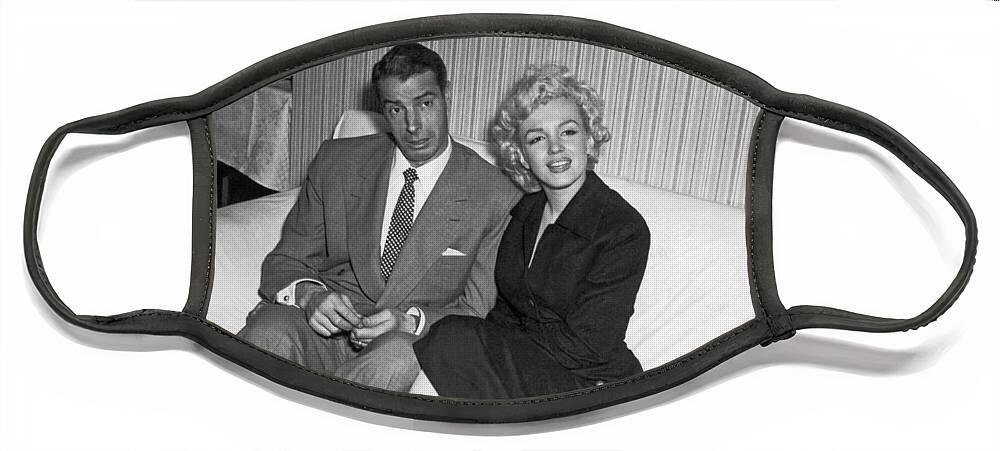 1954 Face Mask featuring the photograph Marilyn Monroe And Joe DiMaggio by Underwood Archives