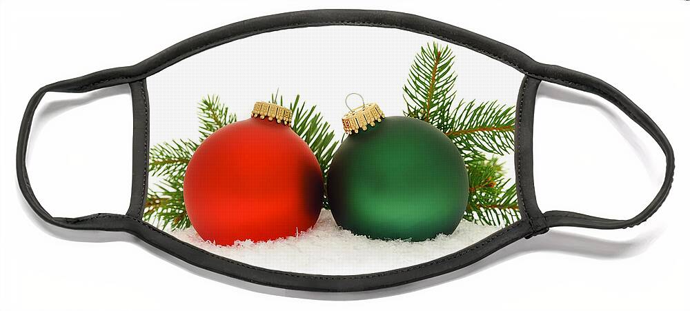 Christmas Face Mask featuring the photograph Red and green Christmas baubles by Elena Elisseeva