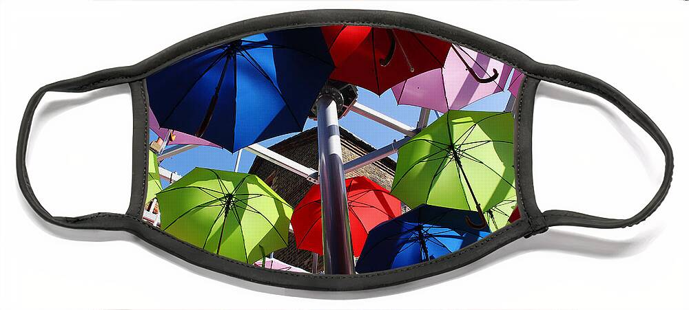Umbrella Face Mask featuring the photograph Umbrellas in the sky by Nicky Jameson