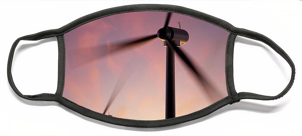 Wind Face Mask featuring the photograph Wind Turbine blades spinning at sunset by Johan Swanepoel