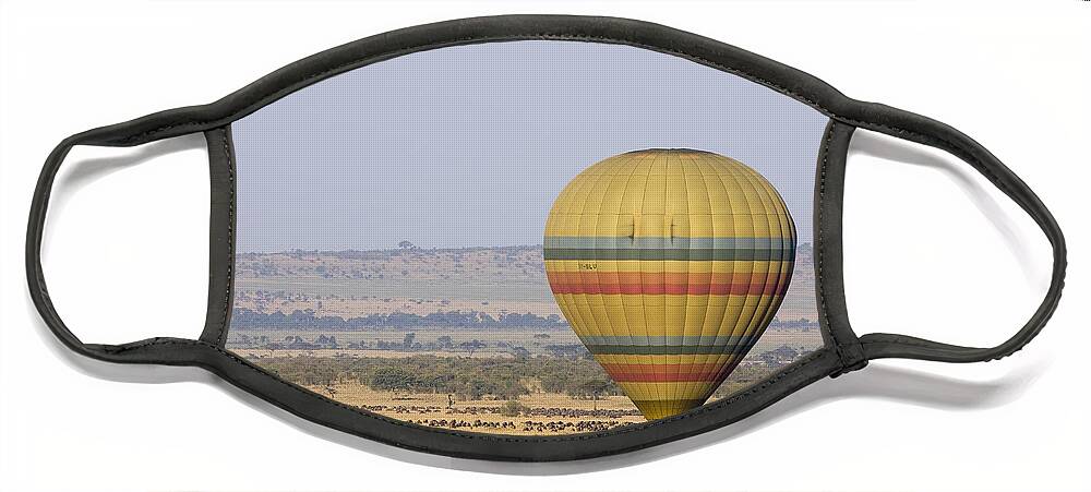 00761909 Face Mask featuring the photograph Hot Air Balloon Flying Over Wildebeest by Suzi Eszterhas