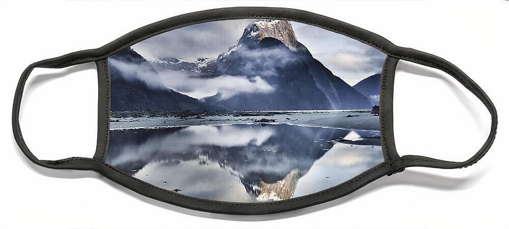 00438708 Face Mask featuring the photograph Mitre Peak Reflecting In Milford Sound by Colin Monteath
