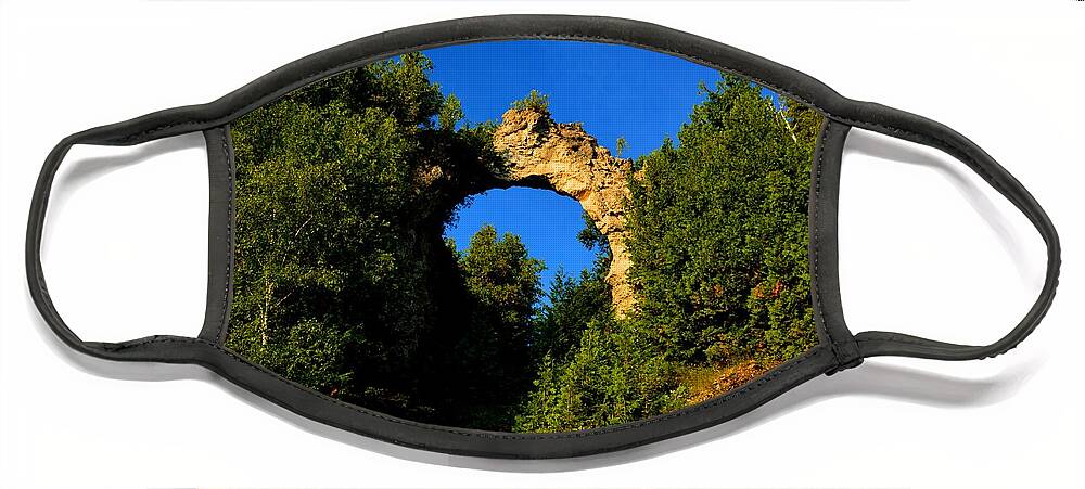 Mackinac Island Face Mask featuring the photograph Beneath Arch Rock by Keith Stokes