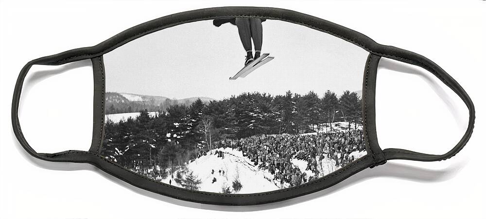 1950's Face Mask featuring the photograph Dartmouth Carnival Ski Jumper by Underwood Archives