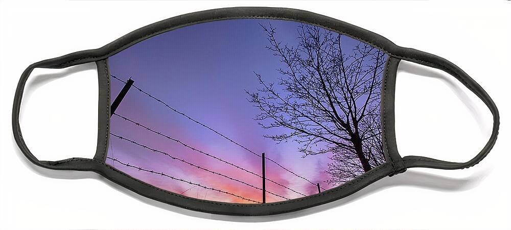Sunset Face Mask featuring the photograph Fiery Norfolk sunset viewed through barbed fence by Simon Bratt