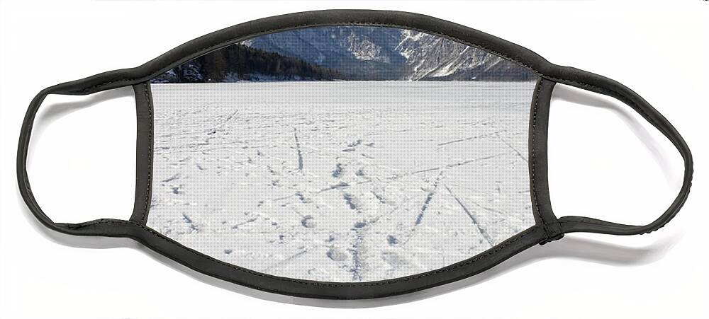 Footprints Face Mask featuring the photograph Footprints on a frozen lake by Ian Middleton