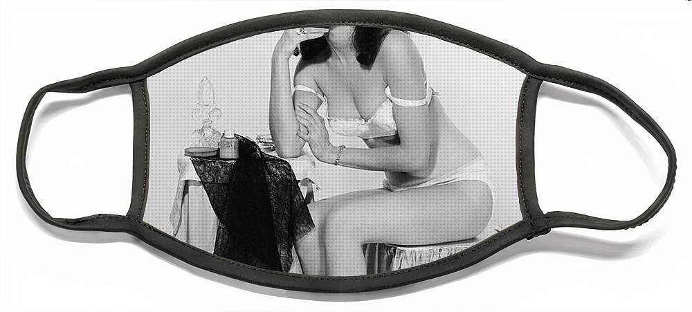 1950s Face Mask featuring the photograph Half-dressed Woman At Dressing Table by H. Armstrong Roberts/ClassicStock
