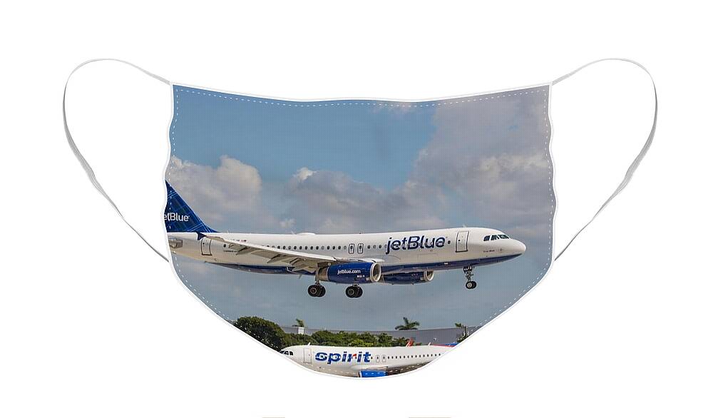 Airplane Face Mask featuring the photograph JetBlue over Spirit Air by Dart Humeston