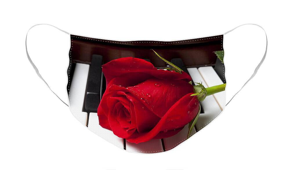 Red Rose Roses Face Mask featuring the photograph Red rose on piano keys by Garry Gay