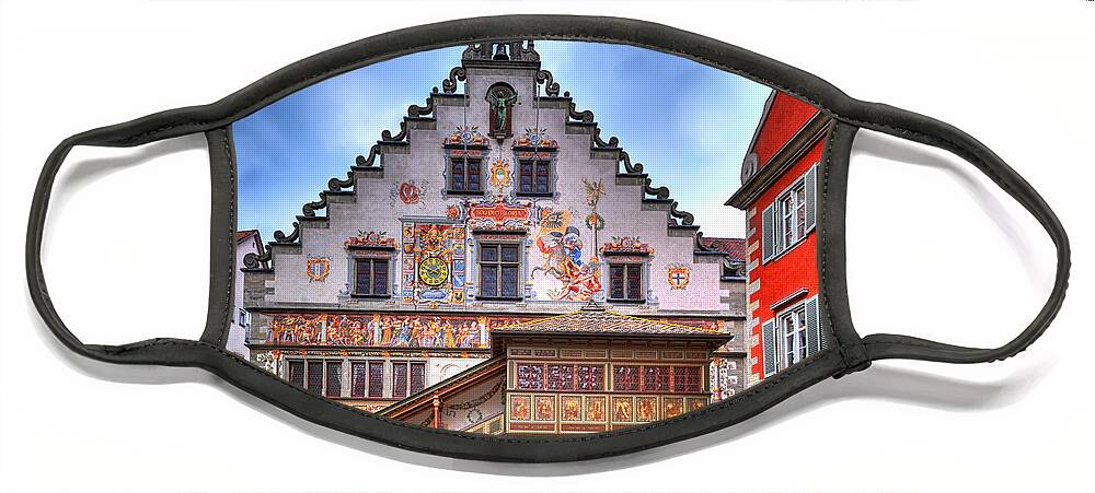 Antique Face Mask featuring the photograph the old townhall on the island of Lindau at the Lake Constance by Gina Koch