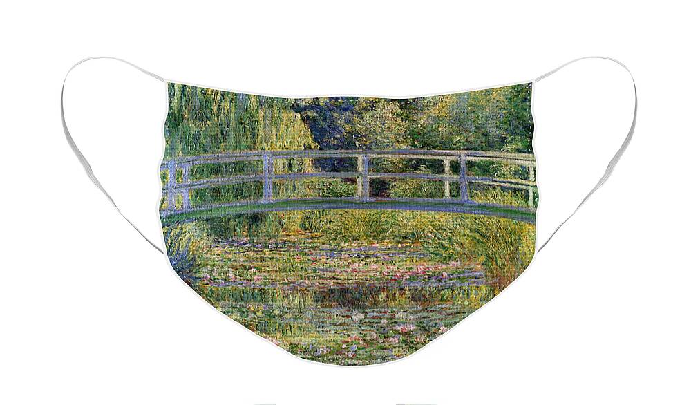 The Face Mask featuring the painting The Waterlily Pond with the Japanese Bridge by Claude Monet