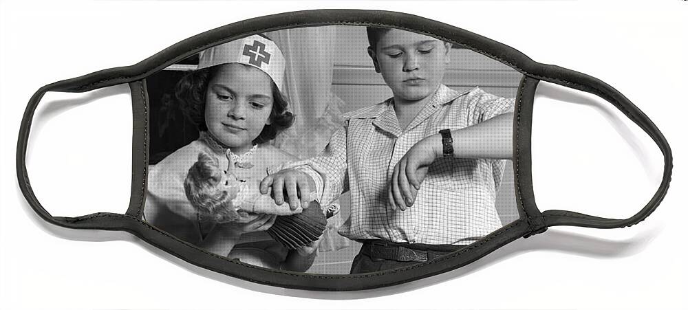 1950s Face Mask featuring the photograph Two Children Playing Doctor, C.1950s by H. Armstrong Roberts/ClassicStock