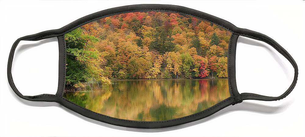 Abenaki Face Mask featuring the photograph Vermont fall foliage reflected on Pogue Pond by Jeff Folger