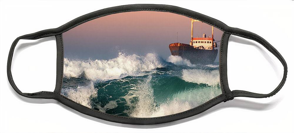 Sea Face Mask featuring the photograph Abandoned Ship and the stormy waves by Michalakis Ppalis