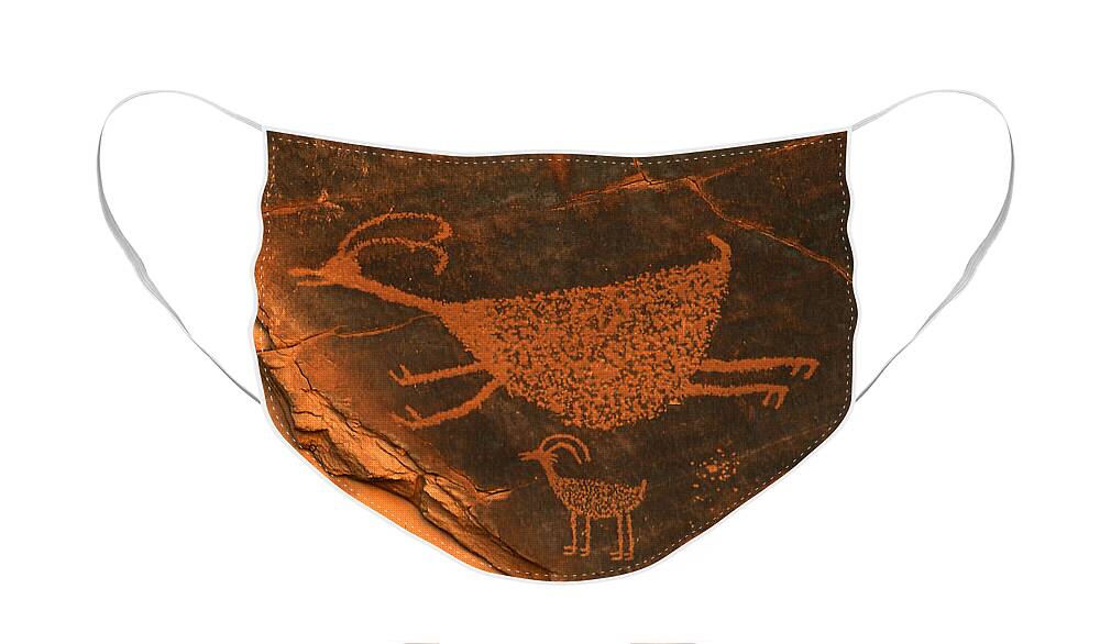 Petroglyph Face Mask featuring the photograph Rock art at Eye Of The Sun Arch by Dan Norris