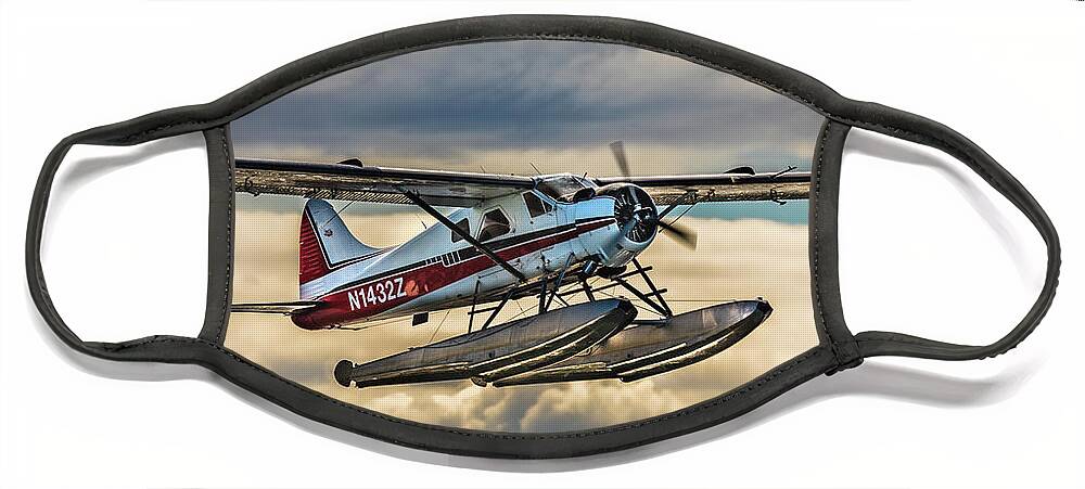 Seaplane Face Mask featuring the photograph Seaplane in the Anchorage sky by Lyl Dil Creations