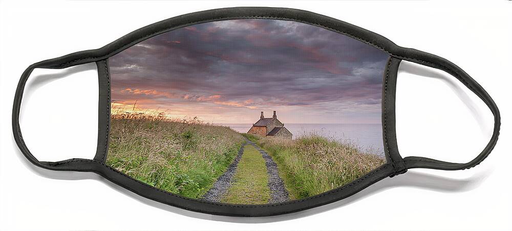 Northumberland Face Mask featuring the photograph A cottage by the sea by Anita Nicholson