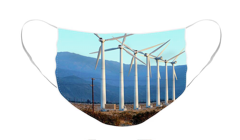 Wind Face Mask featuring the photograph A row of wind turbines to produce green energy in the Palm Springs area of California.	 by Gunther Allen