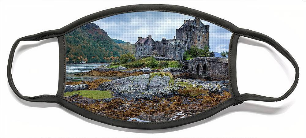 Castle Face Mask featuring the photograph A storm brews over Eilean Donan Castle, Scotland by Jane Rix